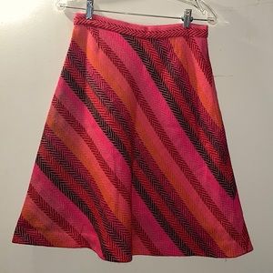 Pinkish skirt with diagonal stripe pattern